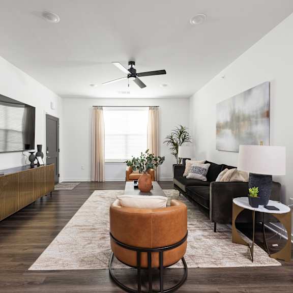 Living area with TV at The Levi Luxury Apartments, McDonough
