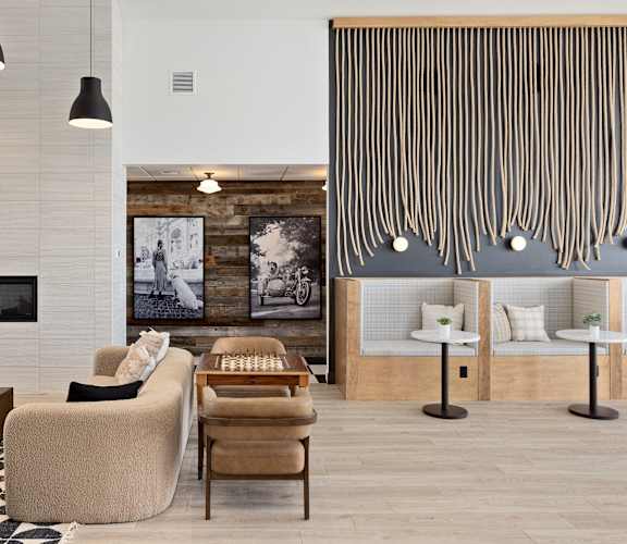 a living room with a fireplace and a black and white checkered rug at The Expo, Billings, Montana