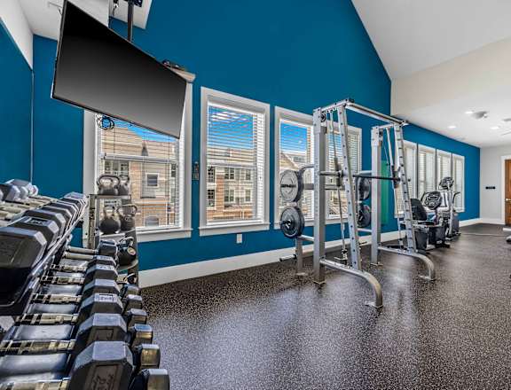 the gym at the enclave at woodbridge apartments in sugar land, tx