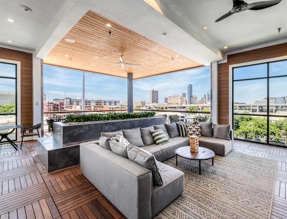 A modern living room with a view of the city skyline.