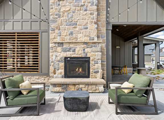 a living room with couches and a fireplace