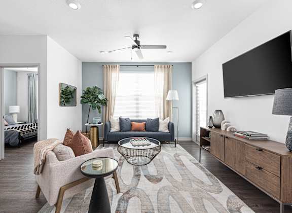 a living room with a couch and a tv