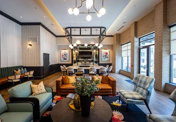 a living room filled with furniture and a large window