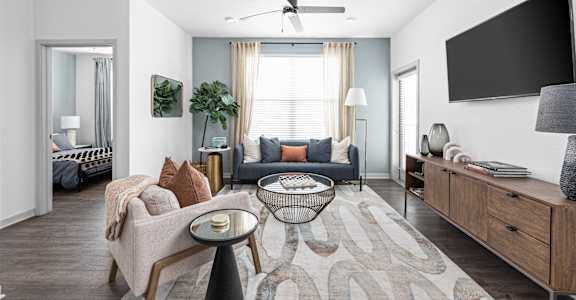 a living room with a couch and a tv