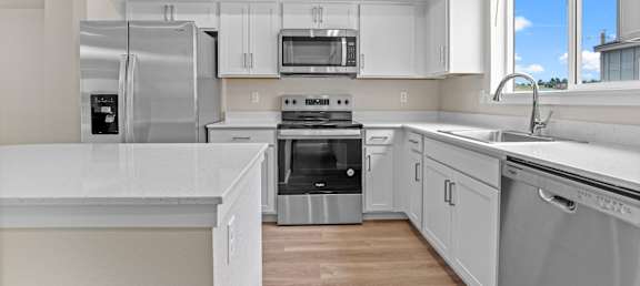 Amazing kitchens with modern appliances at The Townhomes at Pine Drive, Parker, Colorado