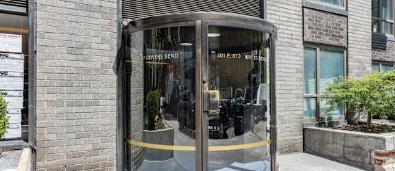 A glass door with a yellow line on the bottom of it.