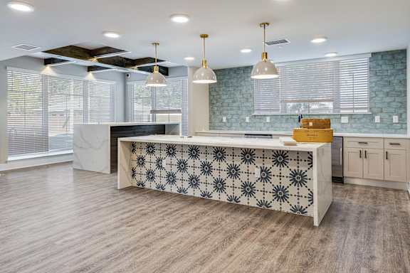 A kitchen with a patterned island in the middle.