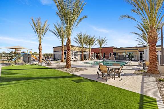 a living room with a brown couch and a rug at Agave House Apartments, Casa Grande, 85122