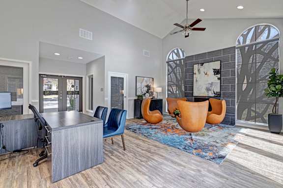 A modern living room with a grey sofa and a wooden table.