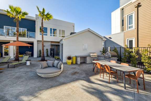 a patio with a table and chairs and a couch in front of a houseat 38° NORTH, Santa Rosa, 95404