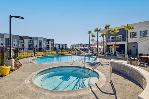 a hot tub and pool with a building in the backgroundat 38° NORTH, Santa Rosa, 95404