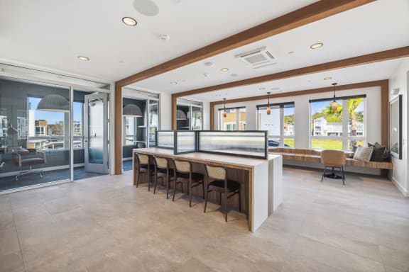 a large kitchen with a bar and chairs in front of it at 38° NORTH, Santa Rosa, 95404