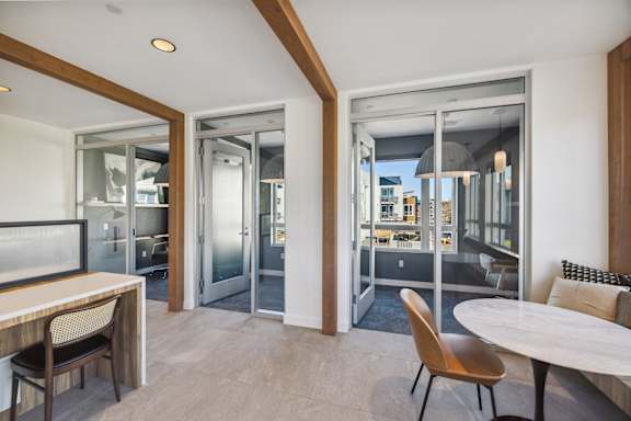 a living room and dining room with sliding glass doors and a view of the city at 38° NORTH, Santa Rosa, 95404