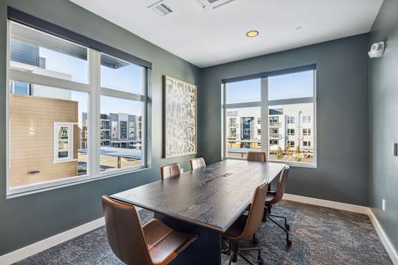a conference room with a large window and a wooden table and chairs at 38° NORTH, Santa Rosa, 95404