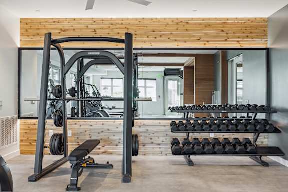 a gym with gym equipment and a wooden wall at 38° NORTH, Santa Rosa, 95404