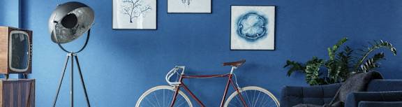 a bike hanging on a wall in a living room
