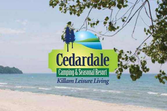 A logo for Cedardale Camping & Seasonal Resort is displayed on a beach.