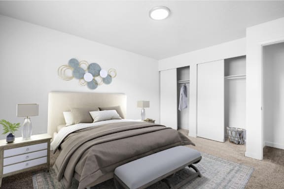 A bedroom with a large bed and a wall art piece above it.