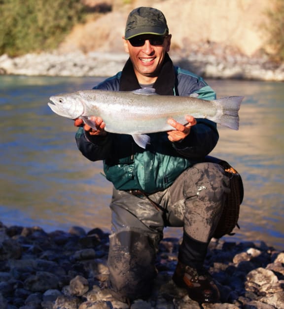 Man Carrying A Fish at Yellowstone Landing, Montana, 59714
