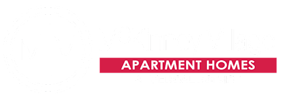 A logo for McKinney Village apartment homes at medical district.