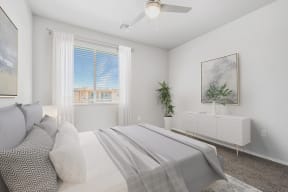 a bedroom with a large white bed and a large window