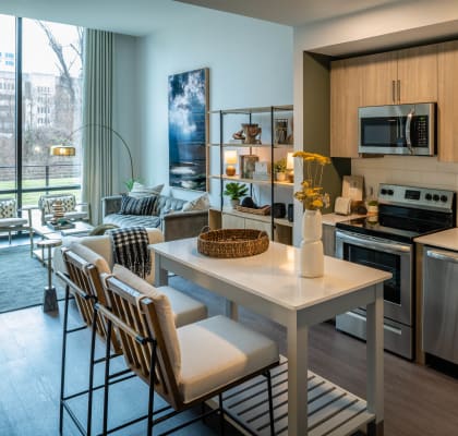 a kitchen and living room at Brentford at The Mile, Tysons, Virginia