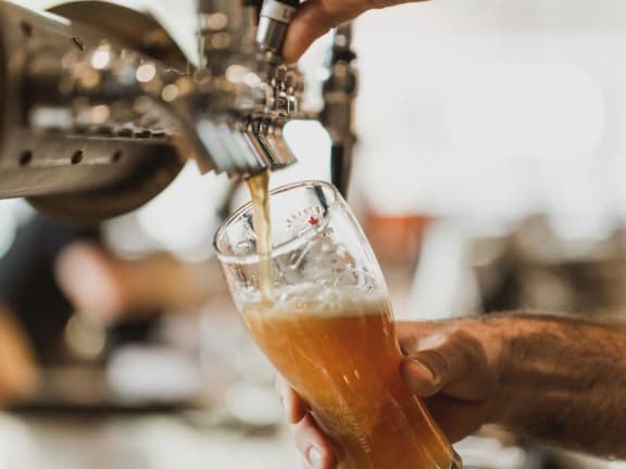 Beer being poured from tap at Mirabella Apartments, Bermuda Dunes, CA
