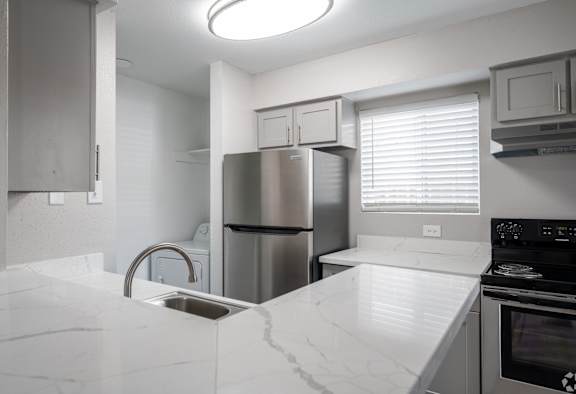 Kitchen with white countertop at Brook Meadow Village, Austin, TX