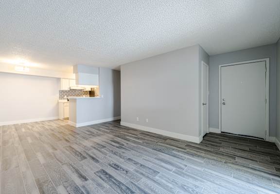 A room with a grey floor and white walls.