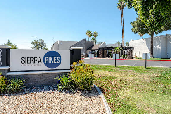 The image shows the entrance to Sierra Pines Apartment Homes.