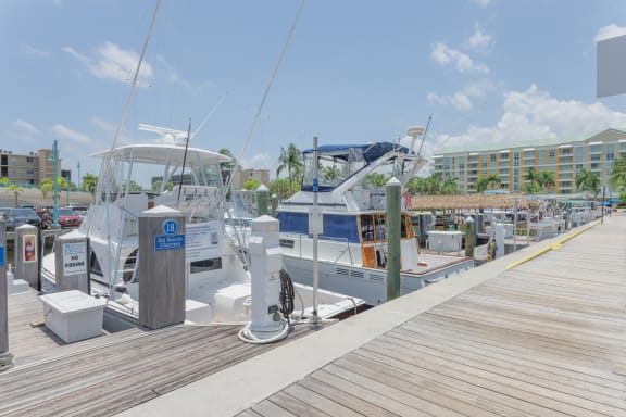 a row of boats docked at a marina