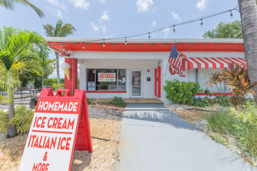a red and white building with a sign that says homemade ice cream italian ice