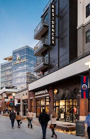 A street view of a shopping area with people walking and stores like DressUp and COMMISSION visible. at Balfour Marietta Apartments, Marietta, GA, 30060