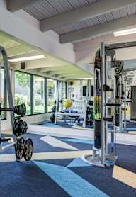 A gym with treadmills and exercise equipment.