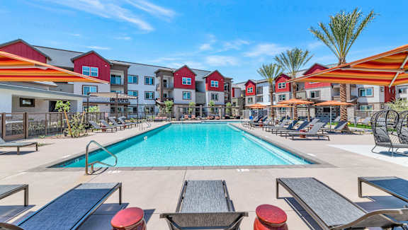 our apartments have a swimming pool with lounge chairs and umbrellas