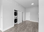 Thumbnail 5 of 10 - A laundry room with a washer and dryer in it.