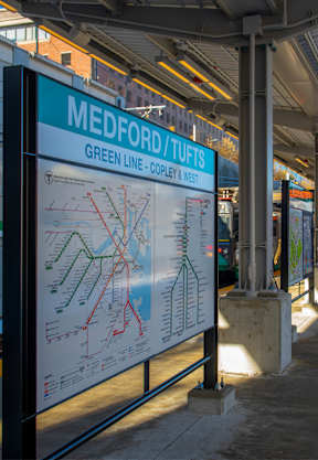 A train station with a map of the Green Line/TUFIS.