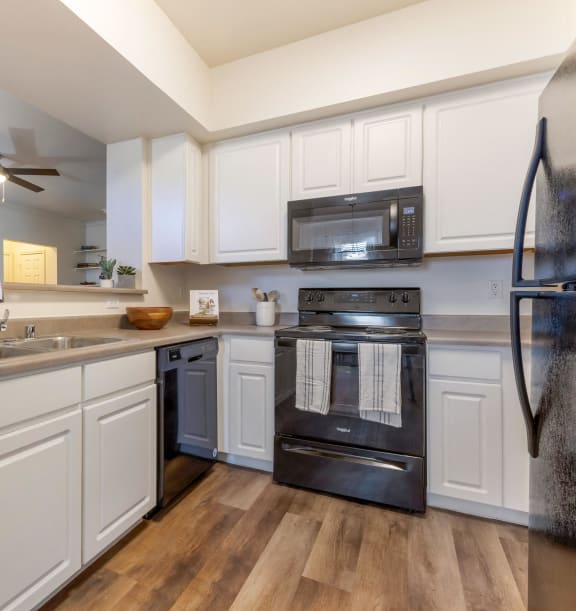 Kitchen with Black Appliances at Trailside Apartments