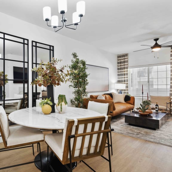 a dining room with a table and chairs