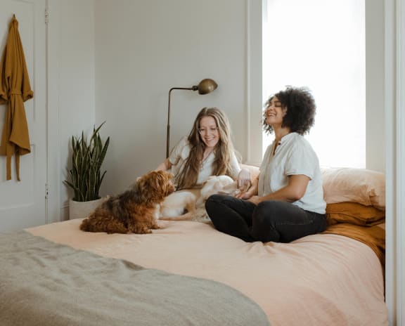 a family of three is laying in bed together