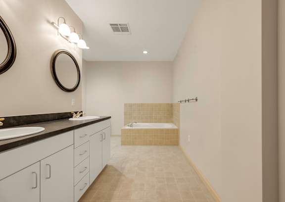 A bathroom with a shower and a sink.