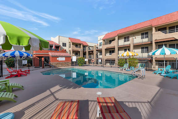 A pool area with a red and white striped pool mat.