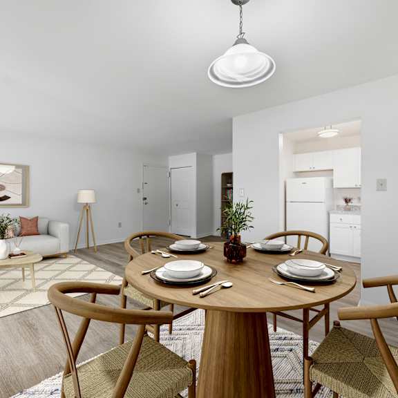 A kitchen with wooden cabinets and a white stove.