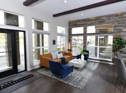a living room with a couch and chairs and sliding glass doors
