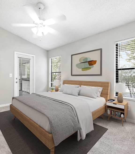 a bedroom with a bed and two windows