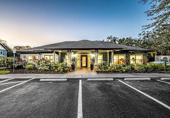 a parking lot in front of a house with a driveway at Ashton Oaks, New Port Richey, Florida