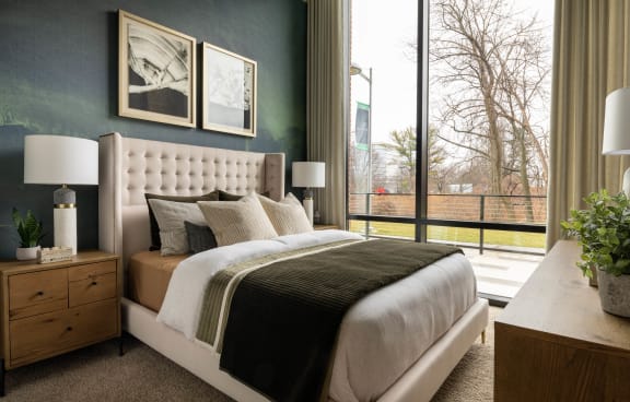 a bedroom with a bed and a window  at Brentford at The Mile, Tysons, VA
