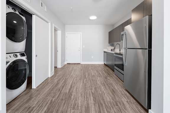 A modern laundry room with a washer and dryer.