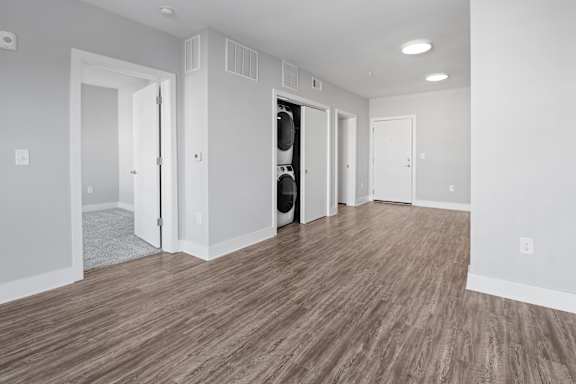 A room with a wooden floor and white walls.