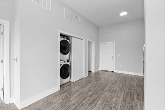 A laundry room with a washer and dryer in it.